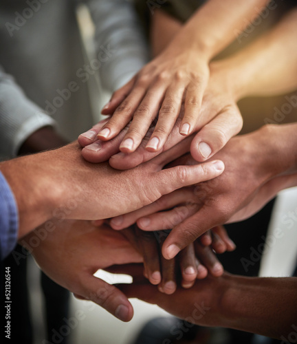 Hands of group of corporate business people in unity for motivation, success and showing teamwork. Team of workers, employees and colleagues piling hands together for support, trust and victory