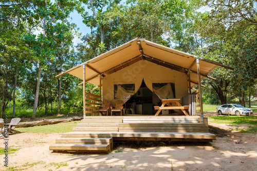 Budget Safari tent in South Africa for family vacations in nature , Safari tented camp in green forest bush nature photo