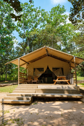 Budget Safari tent in South Africa for family vacations in nature , Safari tented camp in green forest bush nature photo