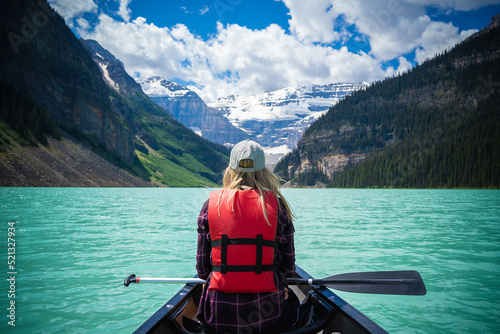 Blonde woman on a canoe in Lake Louise © SETH