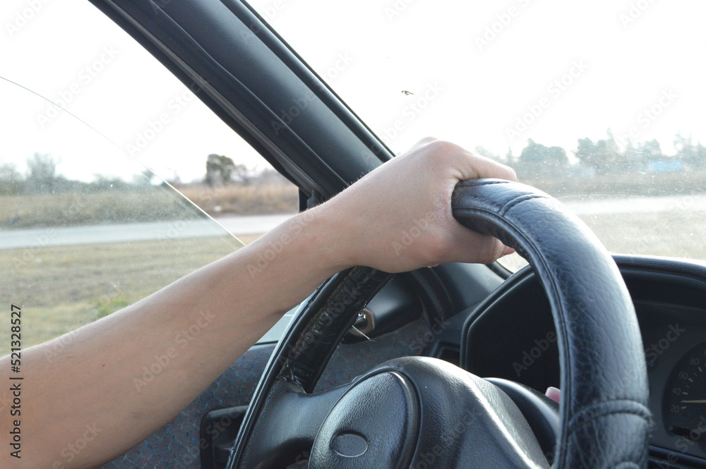 man driving on the road in a car