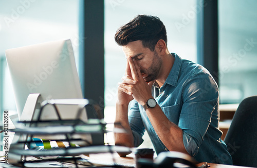 Billede på lærred Stressed businessman with pain, headache or stress while working at office and looking tired exhausted and unhappy