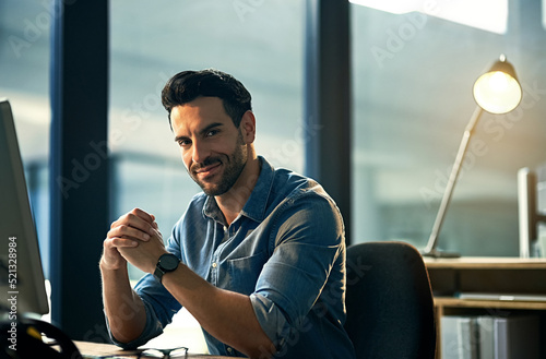 Canvas Print Portrait of a young businessman on a computer during a late night at work