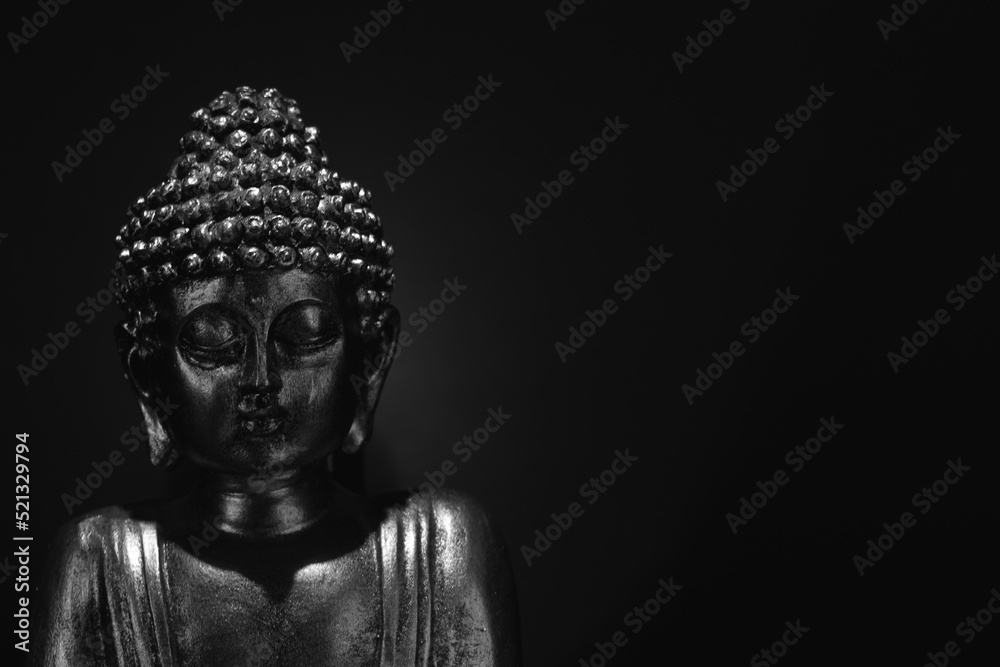 buddha face with incense. black background