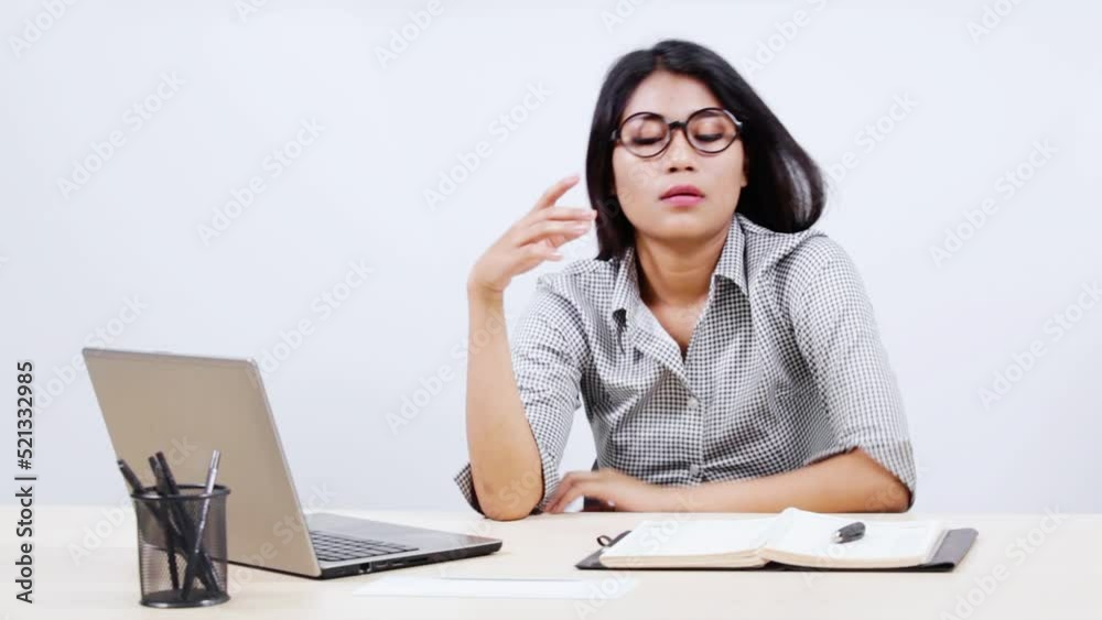 Businesswoman working while thinking an idea Businesswoman working while thinking an idea
