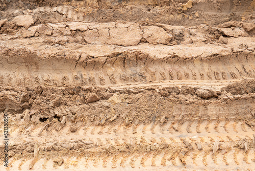 Wheel drift on dry muddy roads. Dirt road surface for transport background.