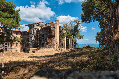 Ancient ruins, abandoned and brownfield of Prinkipo Greek Orphanage, Prinkipo Palace in Princes Island in istanbul, Turkey. Local name is Rum Yetimhanesi, Büyükada. photo