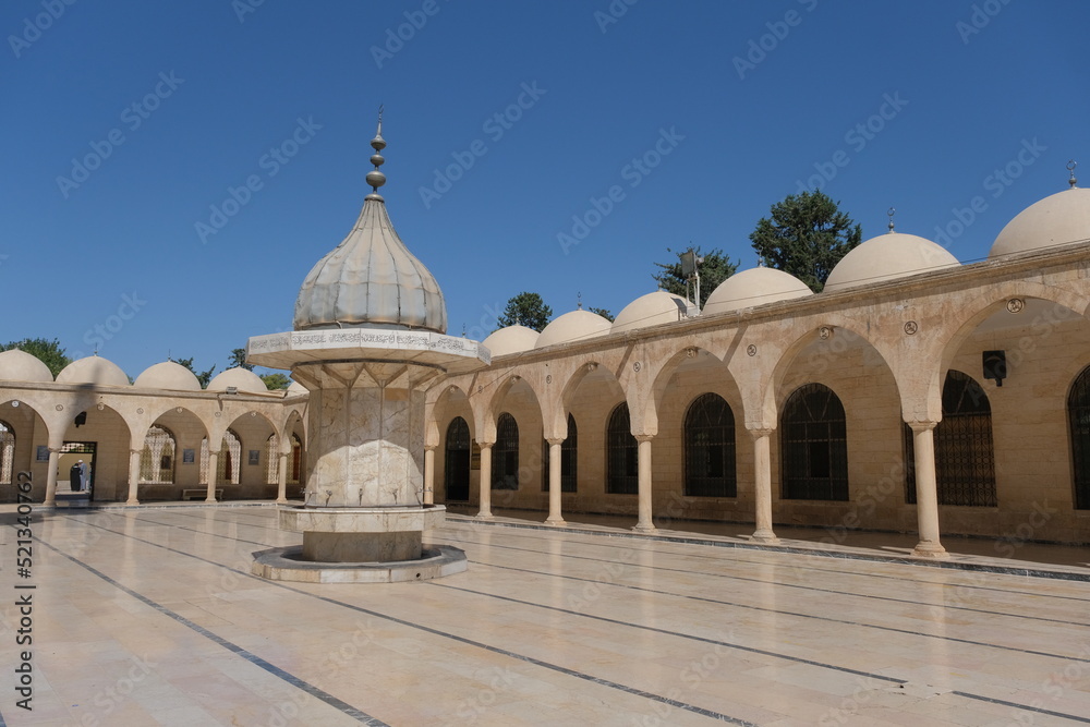 Fototapeta premium Inside the ancient mosque yard in Sanliurfa, Turkey. Mosque made of limestone. 07.11.2022. Sanliurfa. Turkey
