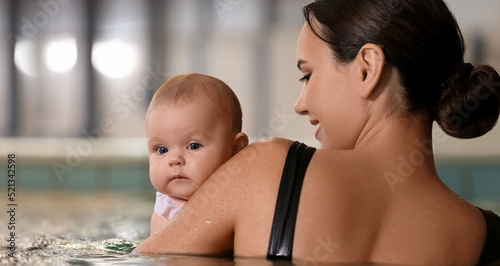 Young swimming coach with l...