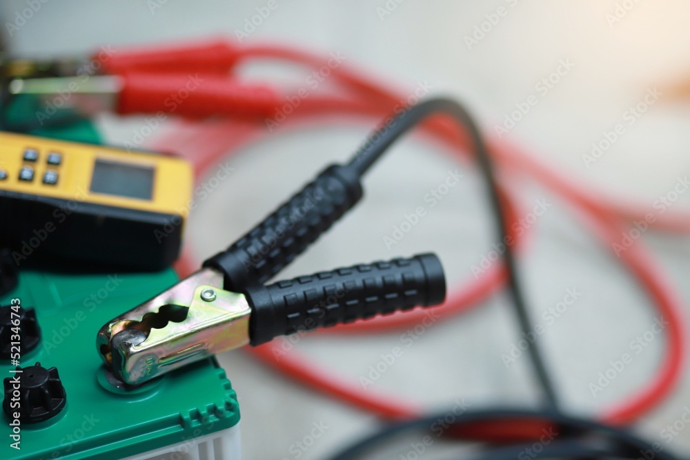 Check and charge the car battery with a charger. Measure voltage, voltmeter, check car battery voltage car battery maintenance Check and charge the car battery with a charger. Measure voltage, voltmeter, check car battery voltage car battery maintenance