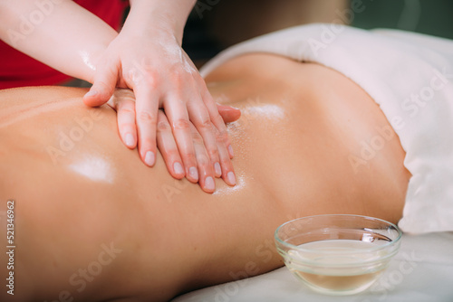 Massage for stress and tension relief. Female massage therapist massaging a woman