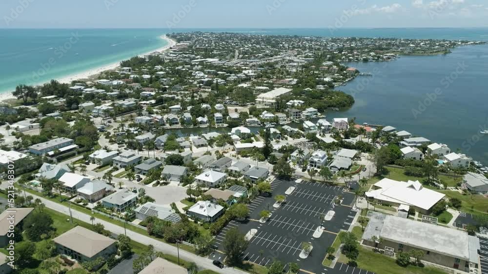 Aerial drone view of the Anna Maria Island with houses, sandy beach and cars in Florida, USA