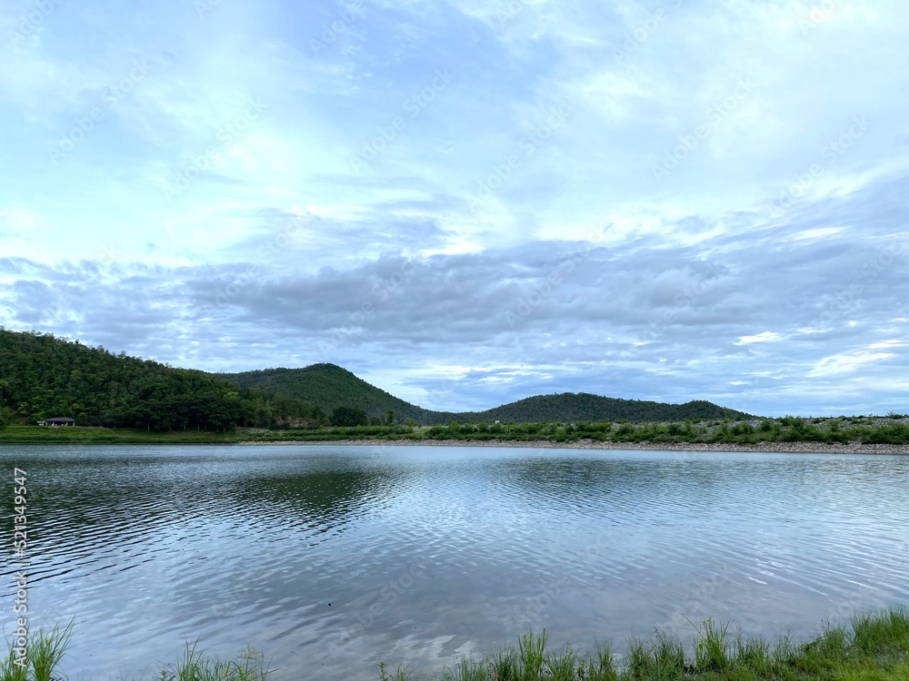 Sky over lake and mountains in the summer. Sky over lake and mountains in the summer.