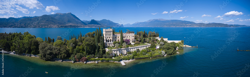 Aerial panorama of the island of Garda. Historic Venetian Neo-Gothic villa on Lake Garda. Panorama of Garda Island located on Lake Garda in Italy.