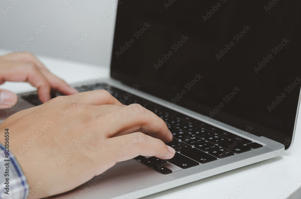 Hand man using keyboard computer laptop digital internet technology network browsing and shopping online and social media. Hand man using keyboard computer laptop digital internet technology network browsing and shopping online and social media.