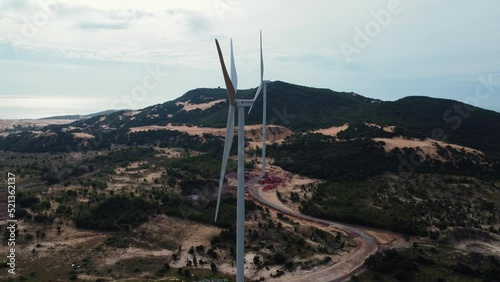 Wind Turbines with an Aerial Shot Orbiting Vietnam's Renewable Energy Technology. photo