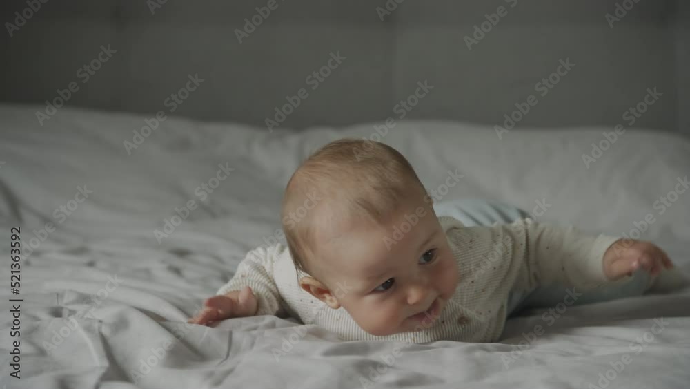 Baby infant kid falling down in an attempt to crawl Baby infant kid falling down in an attempt to crawl