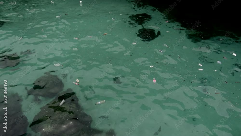 Plastic bottles waste floating in shallow waters - Ang Thong National marine park - aerial drone film - Thailand Plastic bottles waste floating in shallow waters - Ang Thong National marine park - aerial drone film - Thailand