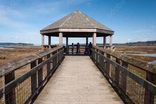 Visitors at a Puget Sound viewpoint in the Billy Frank Jr. Nisqually National Wildlife Refuge, WA, USA