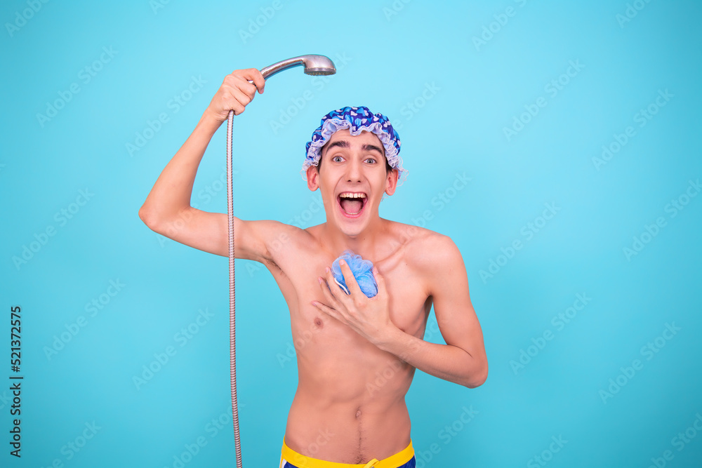 A young attractive guy washes in the shower.	