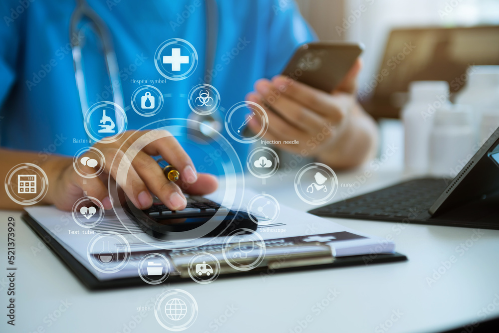 Doctor hold smartphone, conduct financial transactions with calculate expenses - income and data documents, put on the desk in the morning. Doctor hold smartphone, conduct financial transactions with calculate expenses - income and data documents, put on the desk in the morning.