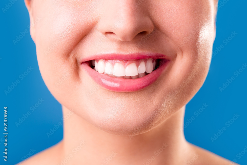 Obraz premium Healthy white smile close up. Beauty woman with perfect smile, lips and teeth. Beautiful Model Girl with perfect skin. Teeth whitening.