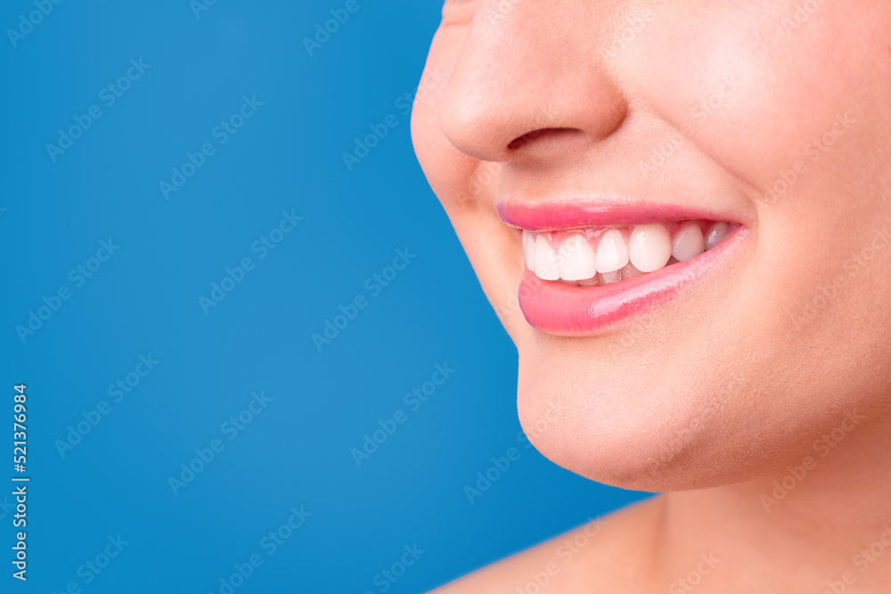 Healthy white smile close up. Beauty woman with perfect smile, lips and teeth. Beautiful Model Girl with perfect skin. Teeth whitening. World Smile Day. Healthy white smile close up. Beauty woman with perfect smile, lips and teeth. Beautiful Model Girl with perfect skin. Teeth whitening. World Smile Day.