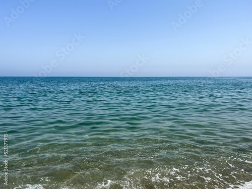 Transparent sea water on the shoreline photo