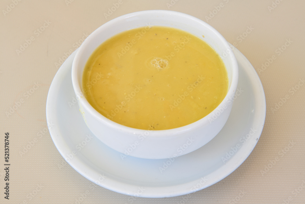 Lentil ( mercimek ) soup with melted butter and red pepper sauce Lentil ( mercimek ) soup with melted butter and red pepper sauce