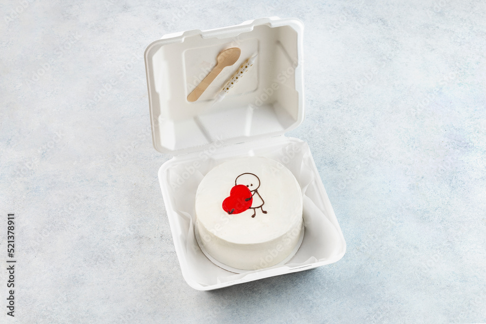 White cake for St. Valentine's Day, Mother's Day, or Birthday, decorated with hearts on pink background