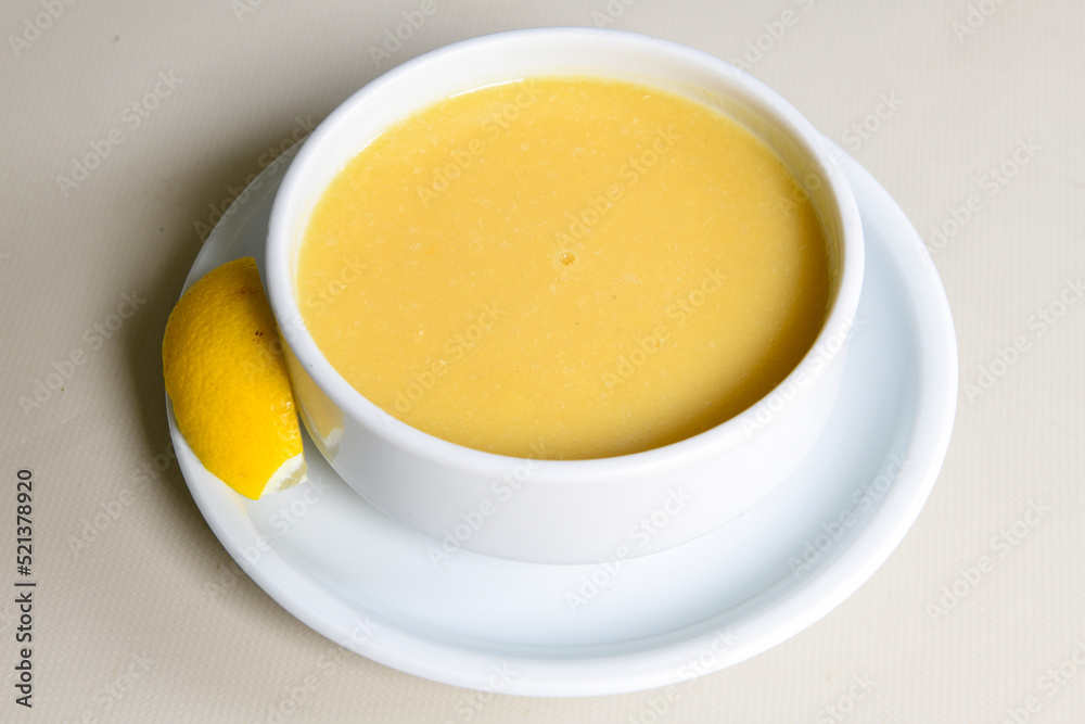 Lentil ( mercimek ) soup with melted butter and red pepper sauce