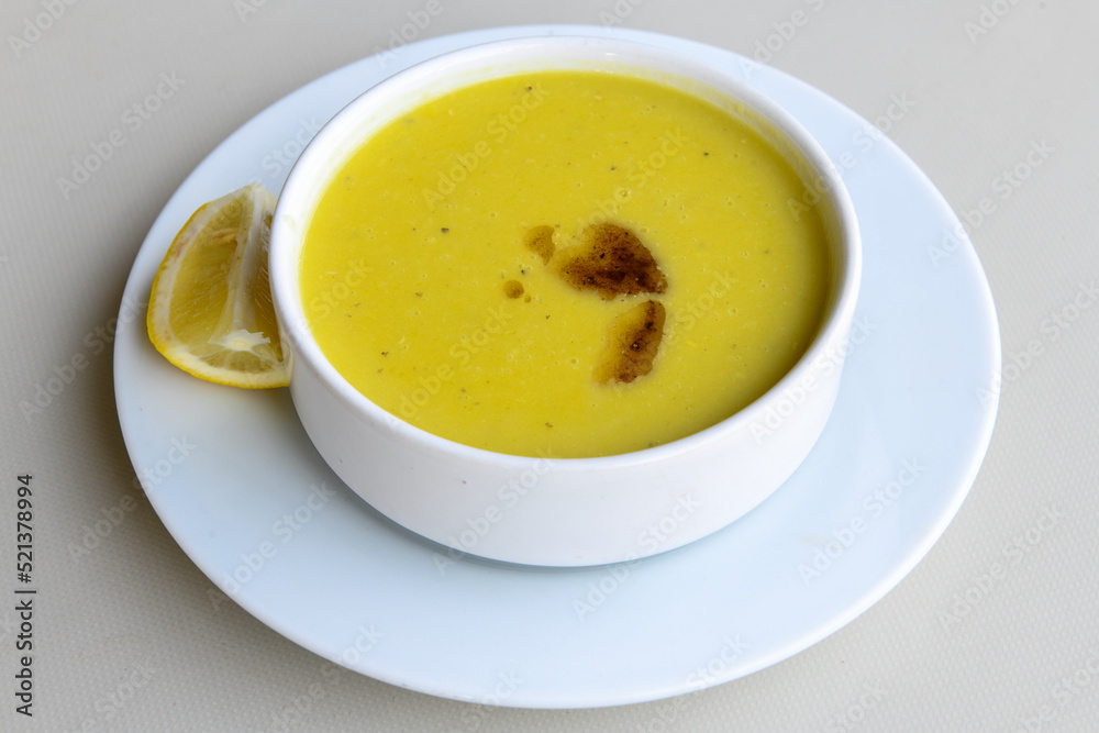 Lentil ( mercimek ) soup with melted butter and red pepper sauce Lentil ( mercimek ) soup with melted butter and red pepper sauce