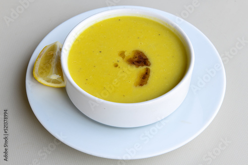 Lentil ( mercimek ) soup with melted butter and red pepper sauce
