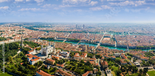 Lyon panorama with Fourviere basilica, Part-Dieu city center Rhone and Saone rivers, France. Aerial view of famous touristic landmarks, French city of lights. Sunny warm summer day, blue sky. photo