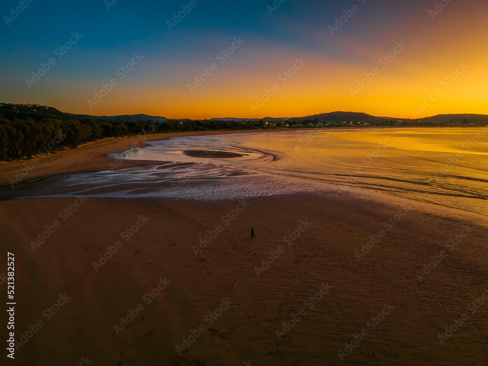 Aerial sunrise seascape with orange glow on a cold Winter's morning