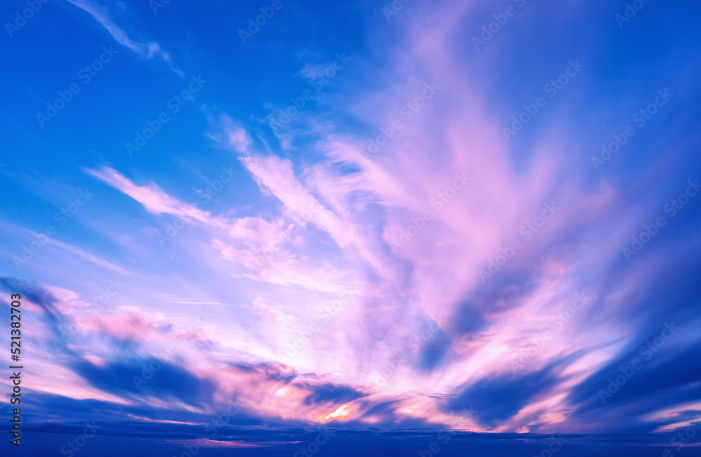 Cloudy sky at sunset. Blue-purple gradient color