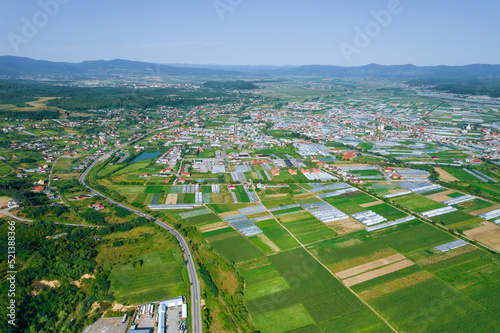 Panoramic view from the heights, industrial villages, where there are many farm greenhouses.