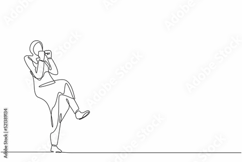 Continuous one line drawing happy Arab businesswoman standing with fold one leg and do yes gesture with both hands. Office worker celebrate success of company project. Single line draw design vector