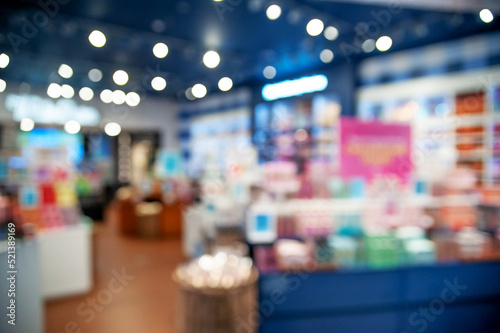 Blurred view of store with different goods, bokeh effect