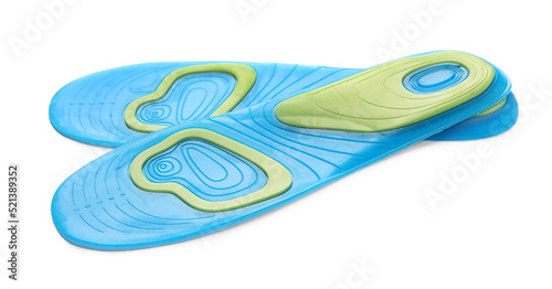 Light blue orthopedic insoles isolated on white © New Africa
