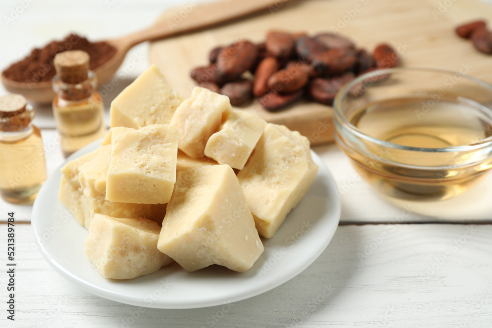 Organic cocoa butter on white wooden table Organic cocoa butter on white wooden table