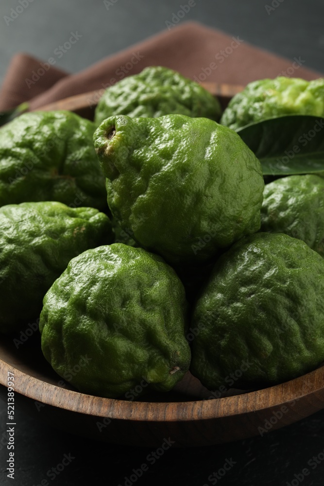 Fresh ripe bergamot fruits in bowl on table, closeup Fresh ripe bergamot fruits in bowl on table, closeup