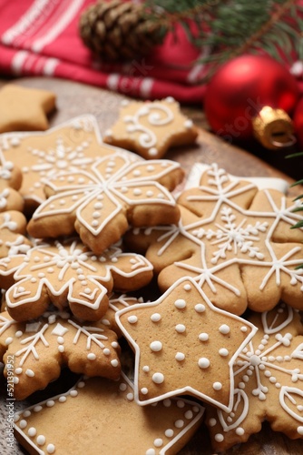 Tasty Christmas cookies on wooden table, closeup