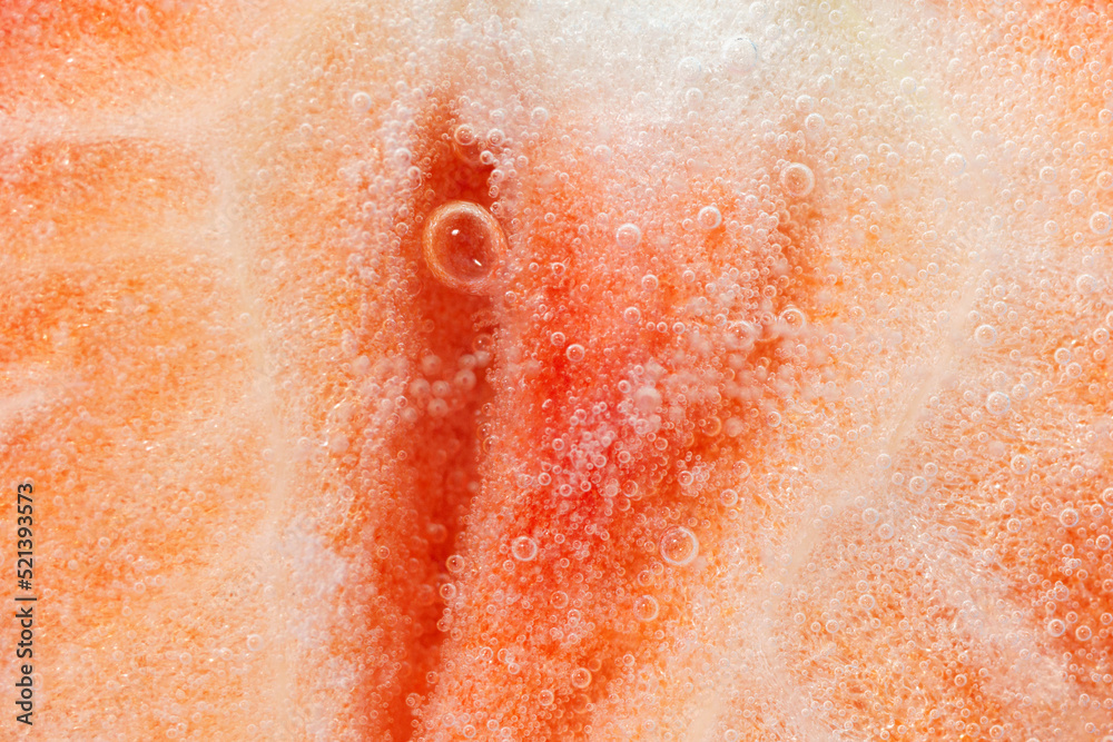 Fototapeta premium Half of red ripe strawberry with a bubble. Close-up. Macro.