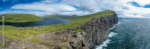 Panoramic View Of The Traelanipan Cliff And Sorvagsvatn Lake at Sunny Day  Vagar  Faroe Islands  Denmark. A Lake Above the Ocean. Natural landmark of Vagar Island