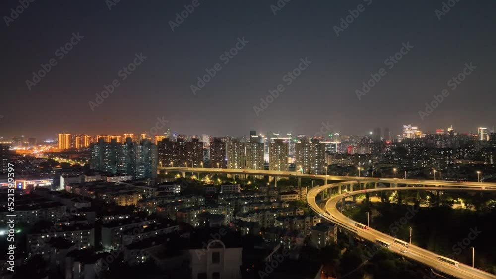 Apartment buildings and traffic in the night. Drone aerial view. Light from the apartment building and highway road in Shanghai China. Economy business cityscape concept b-roll footage. Apartment buildings and traffic in the night. Drone aerial view. Light from the apartment building and highway road in Shanghai China. Economy business cityscape concept b-roll footage.