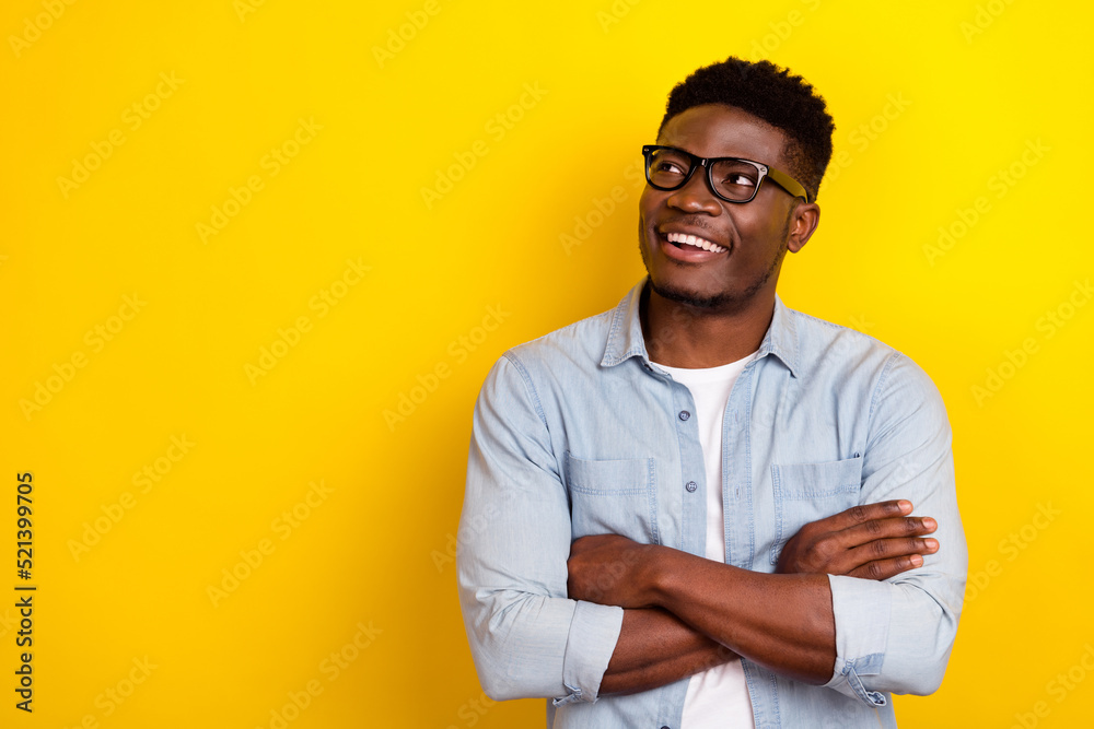 Photo of interested guy representative look empty space ads cross hands isolated shine color background Photo of interested guy representative look empty space ads cross hands isolated shine color background