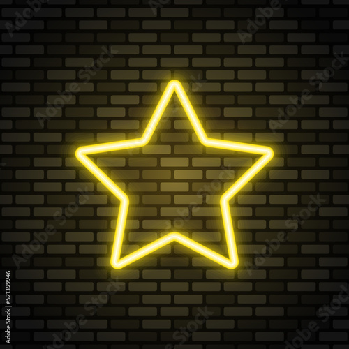 Star neon icon. Yellow neon sign on dark brick wall. Best for polygraphy, mobile apps and web design.