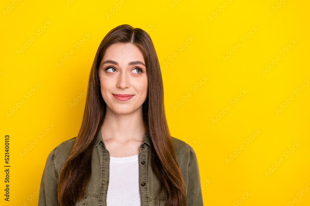 Photo of cheerful dreamy smart adorable female look blank space brainstorming isolated on yellow color background Photo of cheerful dreamy smart adorable female look blank space brainstorming isolated on yellow color background