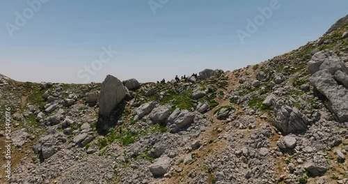 passing over head tourists in mountain with opening view on valley in mountains photo